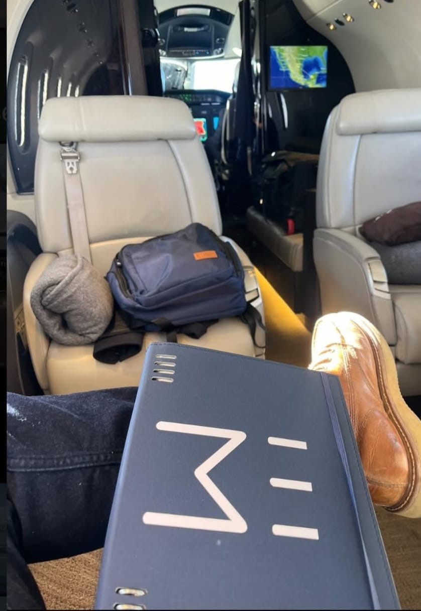 Hunter relaxing inside a private aircraft on the way to a Mexico hunting excursion